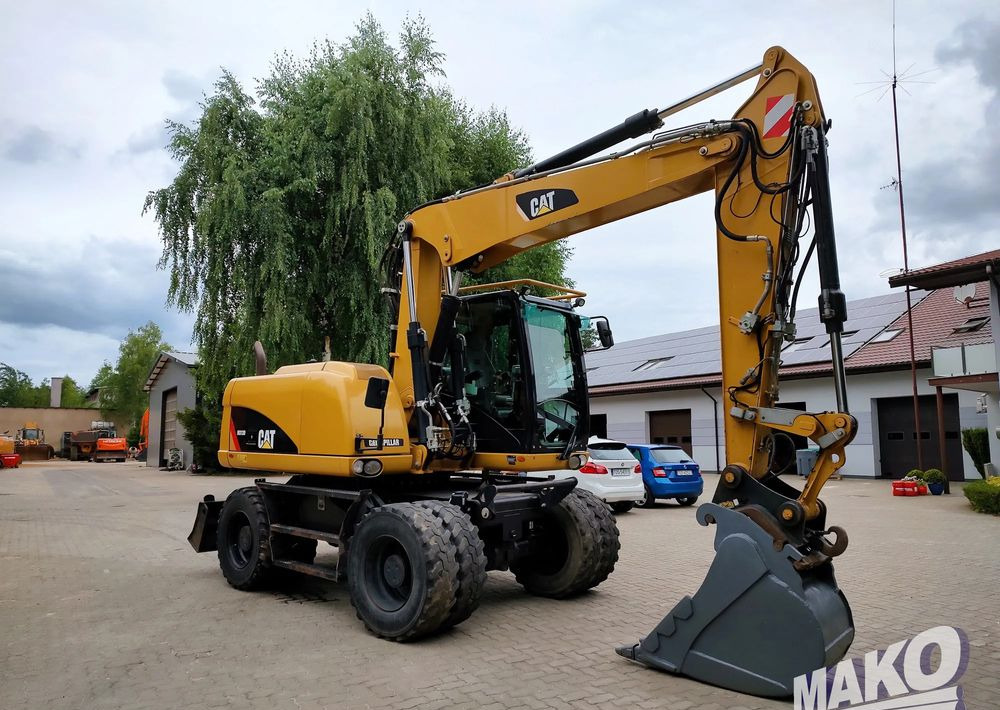 Wheel excavator Caterpillar M313D: picture 6